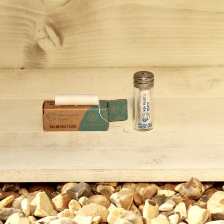 Non Plastic Beach Natural Silk Mint waxed Dental Floss in a Glass Bottle with Metal Lid and Recyclable Cardboard Box